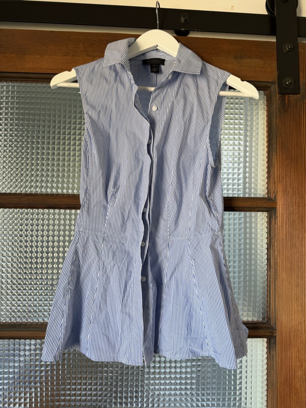 Sleeveless Peplum Blue and White Pinstripe Button-Front Top